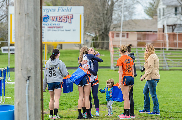 Recognizing the three seniors, Bradee, Jessica, and Autumn