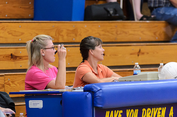 Official Scorekeepers paying close attention to the game