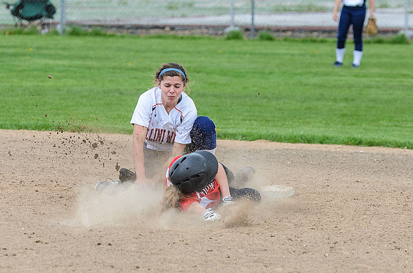 If you notice, the ball is in Holly's glove now, and the runner hasn't reached the base yet